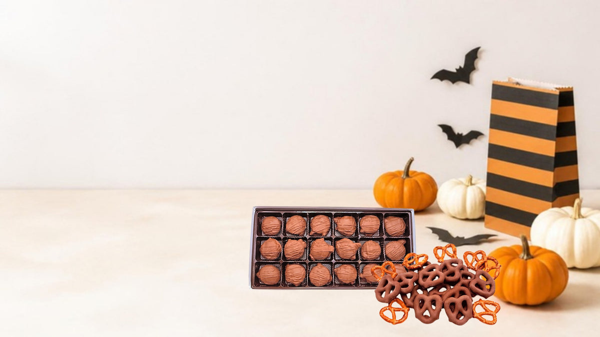 Clark Candies pecan turtles and chocolate covered pretzels with mini pumpkins, paper bats and a striped treat bag